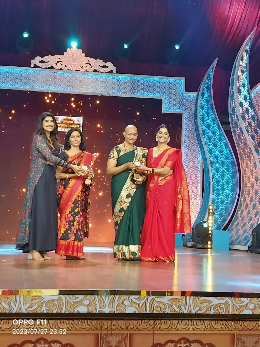 Founders receiving the Zee Marathi Uncha Maza Zoka award on stage
